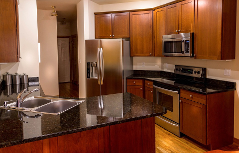 Clean kitchen with empty counter tops