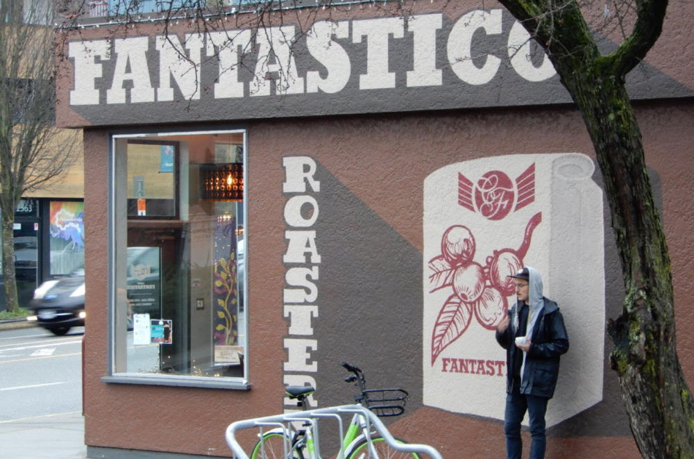 man standing outside Caffee Fantastico