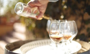 pouring glasses of wine